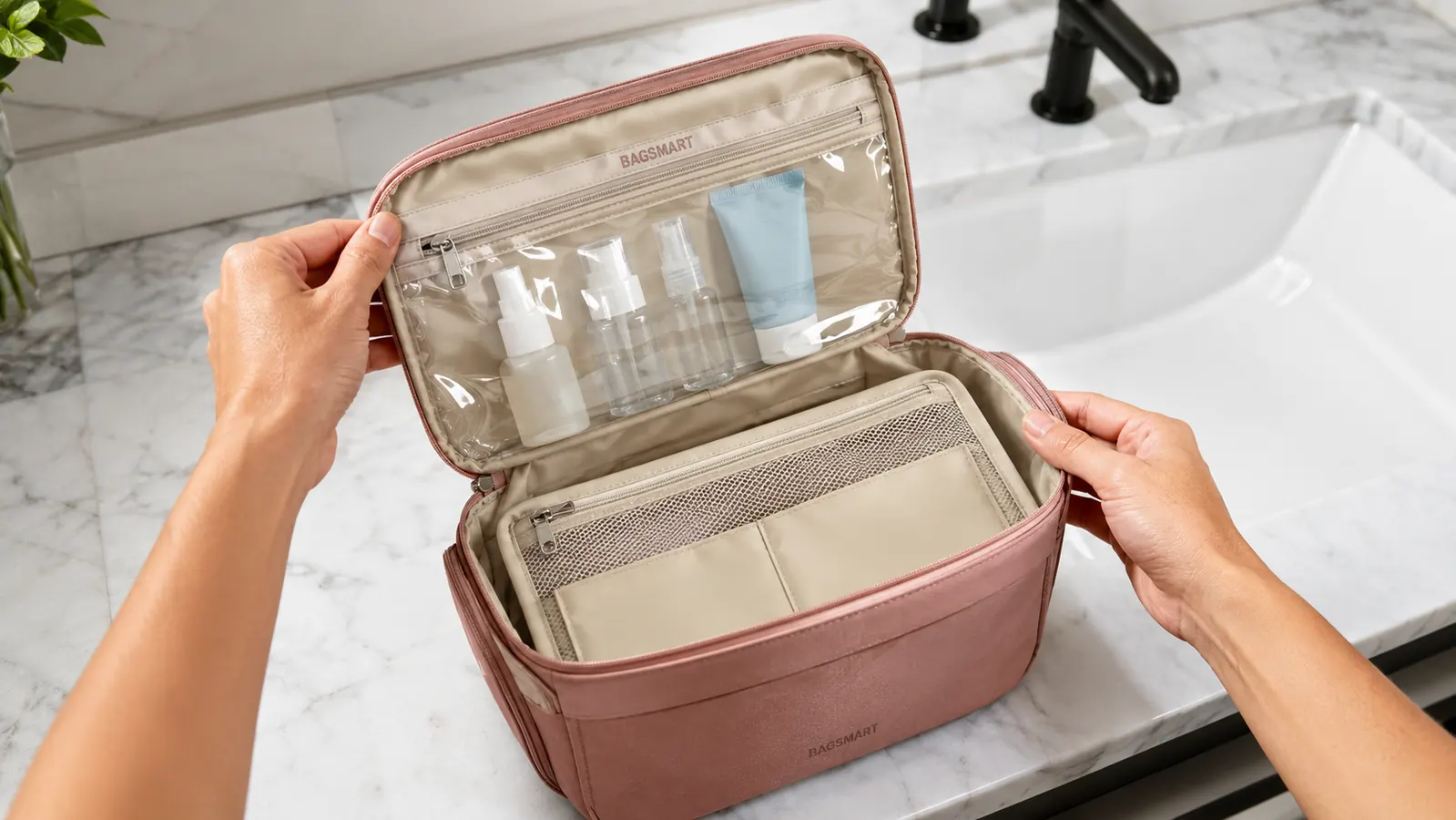 BAGSMART hanging toiletry bag open flat on a bathroom counter showing the TSA transparent cosmetic window and multiple pockets